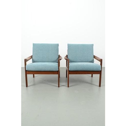 Illum wikkelsø lounge chair set for danish manufacturer niels eilersen. The chairs have been refurbished with a blue...