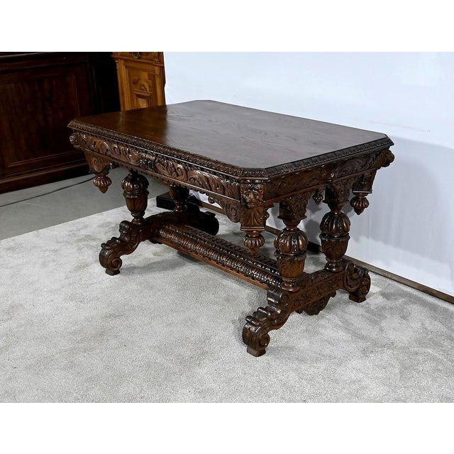 Renaissance Gothic oak office table, with a large belt drawer, carved with foliage and foliage. A concrete wooden draw...