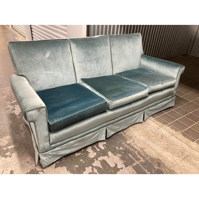 A lovely mid-20th century three-seater couch in original aqua velvet fabric. Dating approximately from the 1950s-1960s....