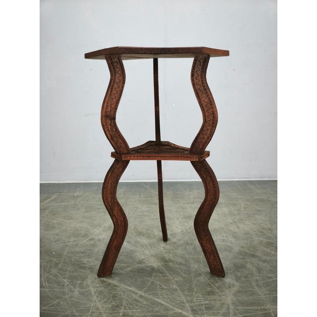 Remarkable hand-carved side table from central europe, dating to the late 19th or early 20th century, circa 1900. Crafted...
