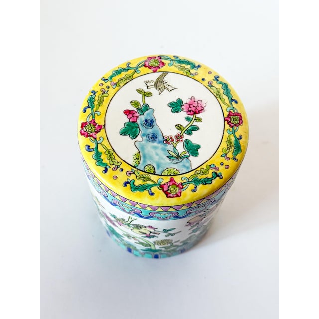 Very charming and colorful Vintage Chinese Famille Rose Tea Jar Canister with lid. The cheerful pattern of peonies and...