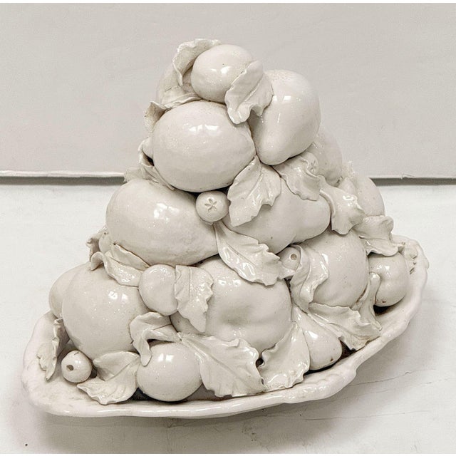 A fine large Italian cream-ware or white glazed ceramic 'bowl of fruit' basket or centerpiece with mixed fruit topiary top...