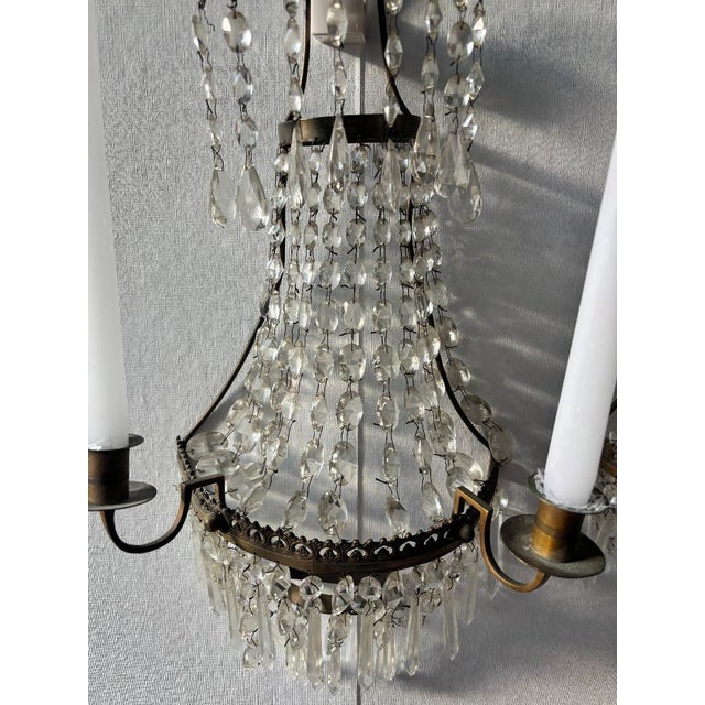 This beautiful pair of mid-20th century vintage crystal cascade sconces (or small chandeliers) captures the romantic...