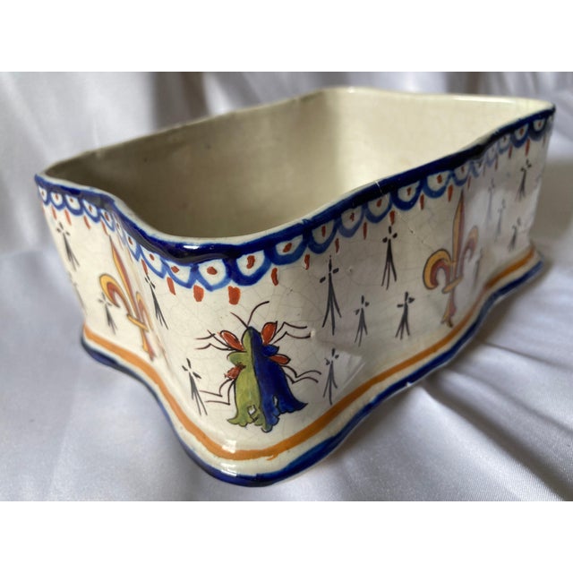 A charming hand-painted French faience box or jardinière, distinguished by its wonderfully irregular form and colorful...