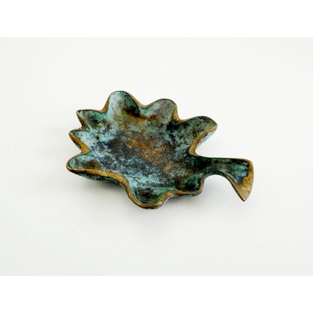 Vintage circa 1950s ashtray or small catchall dish with a biomorphic, stylized leaf form. Made of solid brass with...