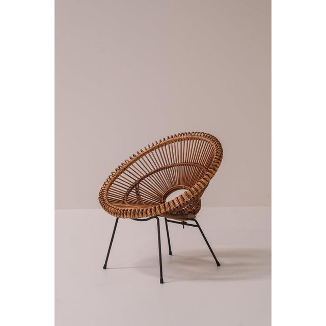 Rare pair of french rattan lounge chairs designed by janine abraham and dirk jan rol and produced by rougier in france...
