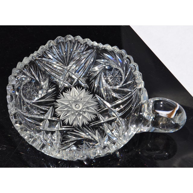 This American Brilliant Period Cut Glass Bowl is a finely crafted, deep-cut crystal bowl from 1876 to World War I, known...
