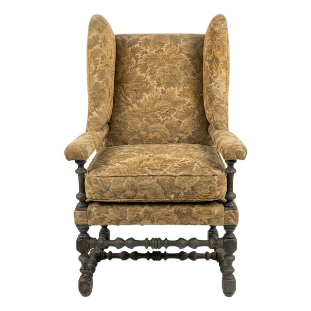 Early 20th Century Wingback Armchair Featuring a Floral Tapestry Fabric and Turned-Spindle Wooden Legs For Sale