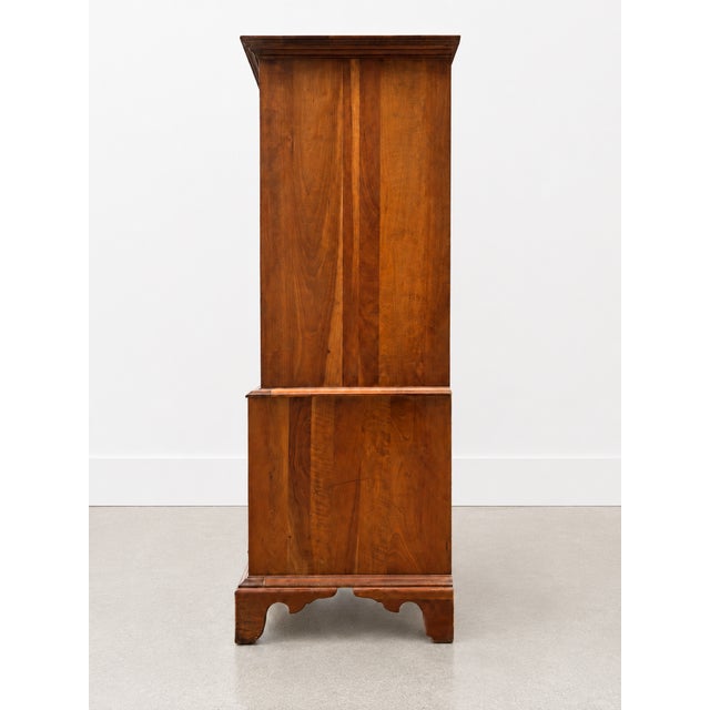 Vintage tall chest by Unique Furniture Makers, crafted in warm-toned wood with classic brass bail pulls, dovetail drawer...