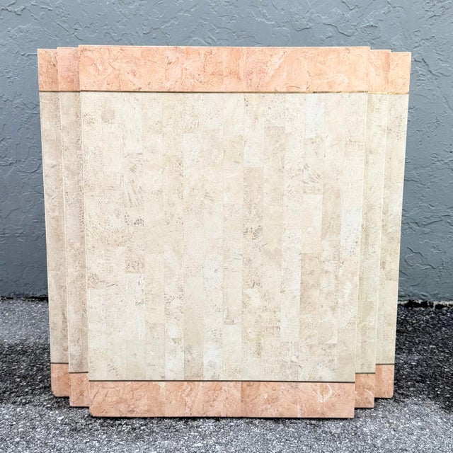 This postmodern pedestal makes a bold architectural statement with its stepped silhouette and tessellated stone surface....