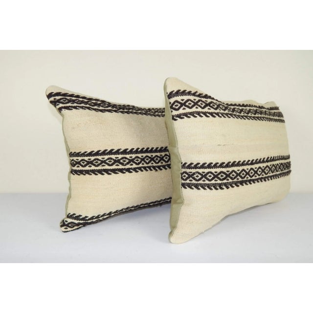 This handwoven kilim pillow is made from Anatolia and Middleast Kilim fragments. Each of our kilim pillow cover is cut...