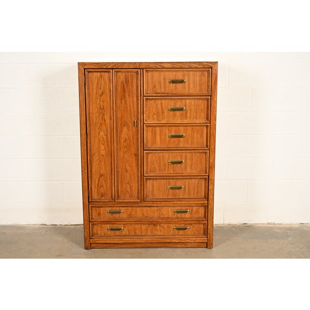 A gorgeous Mid-Century Modern Hollywood Regency Campaign armoire dresser or gentleman's chest By Thomasville USA, Circa...