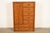 A gorgeous Mid-Century Modern Hollywood Regency Campaign armoire dresser or gentleman's chest By Thomasville USA, Circa...