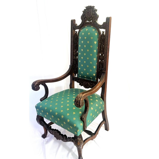 Fit for a king or queen, this early turn of the 20th Century French Style Throne chair, ornately decorated with a crowned...