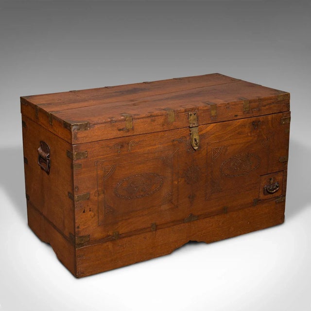 This is an antique travelling cleric's chest. An Anglo-Indian, teak colonial trunk with fitted interior, dating to the...
