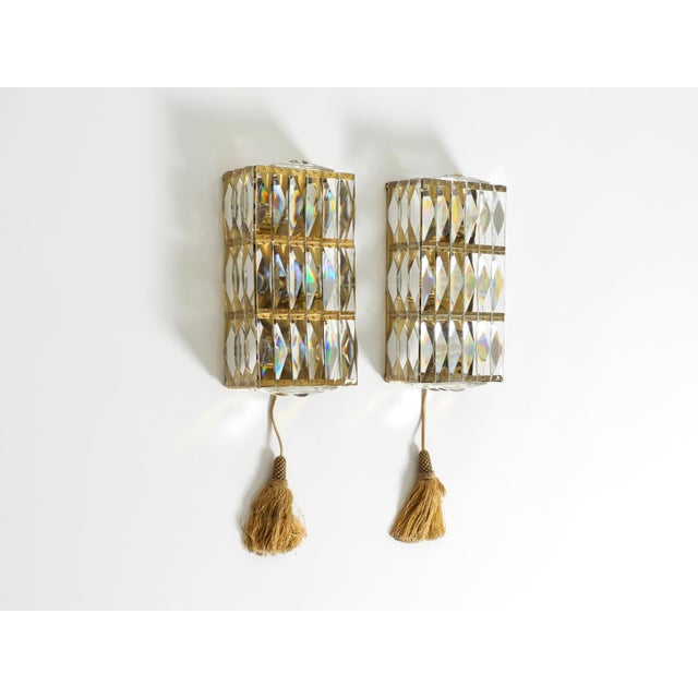 Pair of rectangular 1960s brass wall lamps with crystal prism shades by bakalowits & söhne. Made in austria. the entire...
