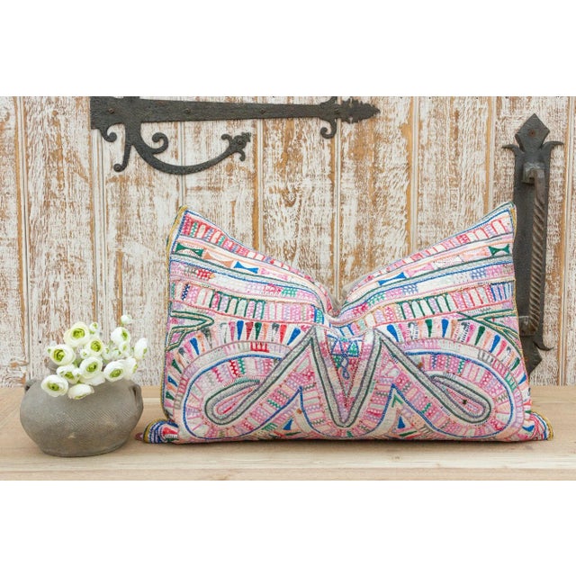 These colorful throw pillows are made from Rabari tribal dowry bags. The embroidery is on cotton and has intricate chain...