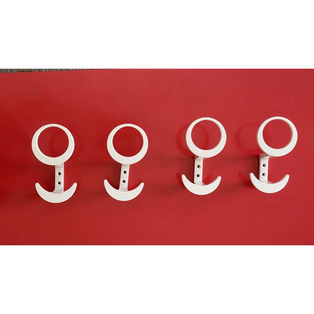 Set of four well-designed vaguely flower shaped Space Age plastic coat hooks by Austrian manufacturer KM Austria from the...