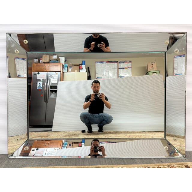 Design Plus Gallery presents a Vintage Wall Mirror in the Style of Donghia. The mirror has a thick beveled edge that...