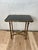 An elegant vintage faux bamboo side table executed in brass with refined neoclassical lines and a sophisticated Hollywood...