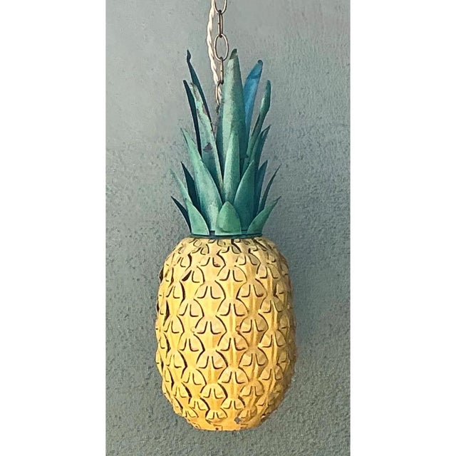 This vintage metal pineapple pendant light is a wonderfully whimsical example of figurative mid-century lighting design,...