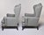 Found in England, this pair of wing chairs date from the 1940s. Newly upholstered in a gray/green subtle tweedy fabric...