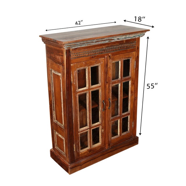 The Reclaimed Wood Cabinet with Glass & Wood Doors by Manzel Furniture is a rectangular-shaped piece with a shabby chic...
