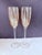 A refined pair of vintage champagne flutes in a warm amber blush tone, embodying the understated elegance of mid-century...