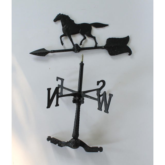 1970's cast aluminum equestrian weather vane. Stamped "Whitehall". Dated 1971. Some age wear to painted black finish.