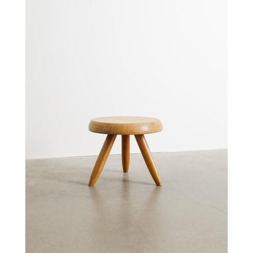 A rare and iconic decorative French mid century wooden "Berger" low tripod stool in natural patinated cherry wood by...