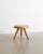 A rare and iconic decorative French mid century wooden "Berger" low tripod stool in natural patinated cherry wood by...