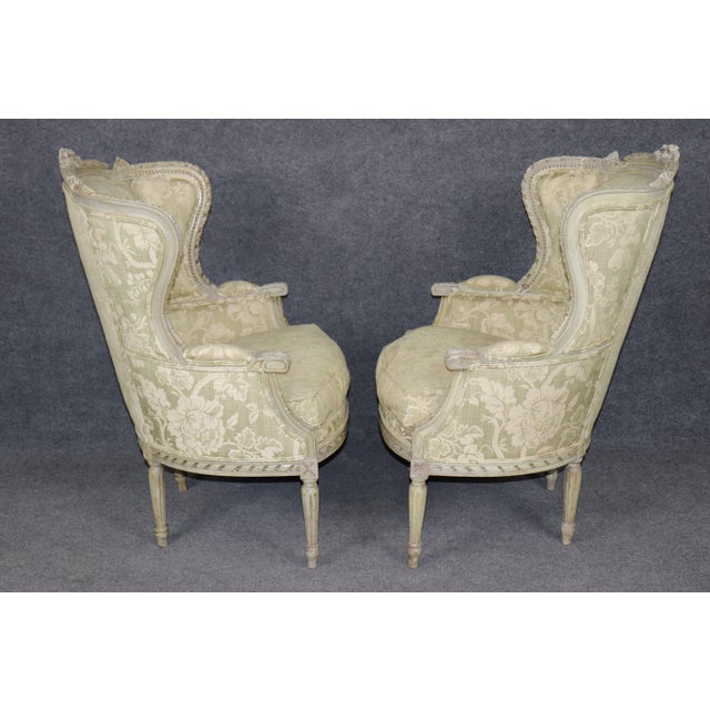 French Pair of French Louis XVI Style Distressed Painted Wingback Bergere Chairs For Sale - Image 3 of 13