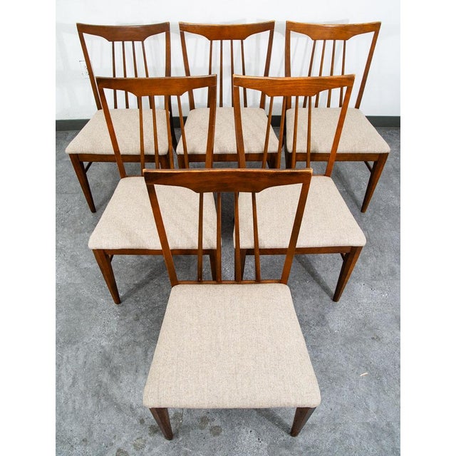 Set of 6 Keller furniture dining chairs in stained oak. Each chair offers new wool tan upholstery. Price is for 6 chairs....