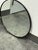 Design Plus Gallery presents a Metal Framed Mirror from Rejuvenation. The mirror showcases a clean circular profile with a...