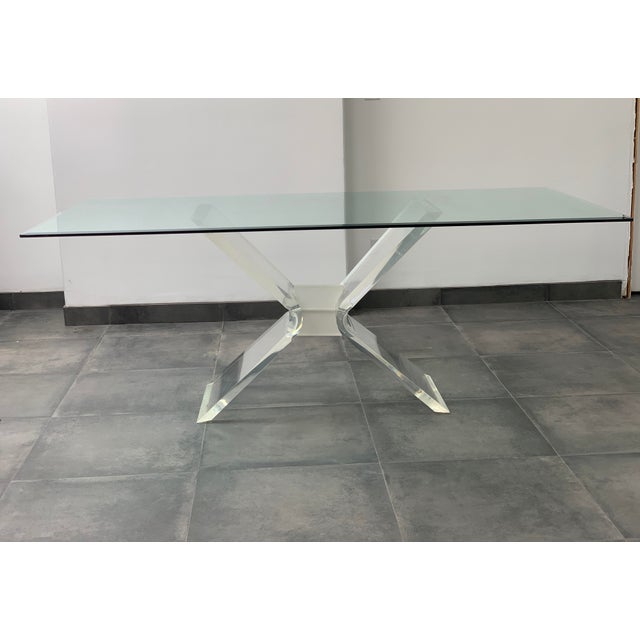 1970s Hollywood Regency large, glass and lucite dining table. Such a glamorous and gorgeous table to have your family...