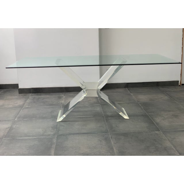 1970s Hollywood Regency large, glass and lucite dining table. Such a glamorous and gorgeous table to have your family...
