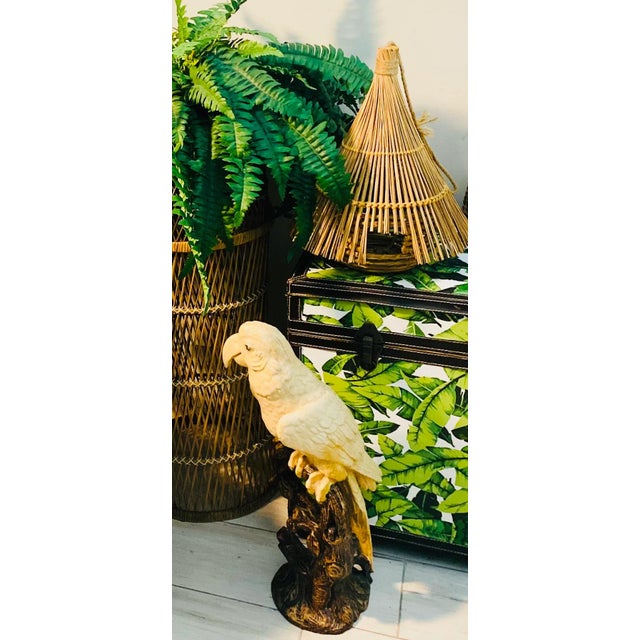 Beautiful vintage statue of a parrot bird on a branch. Perfect indoor or in your garden.