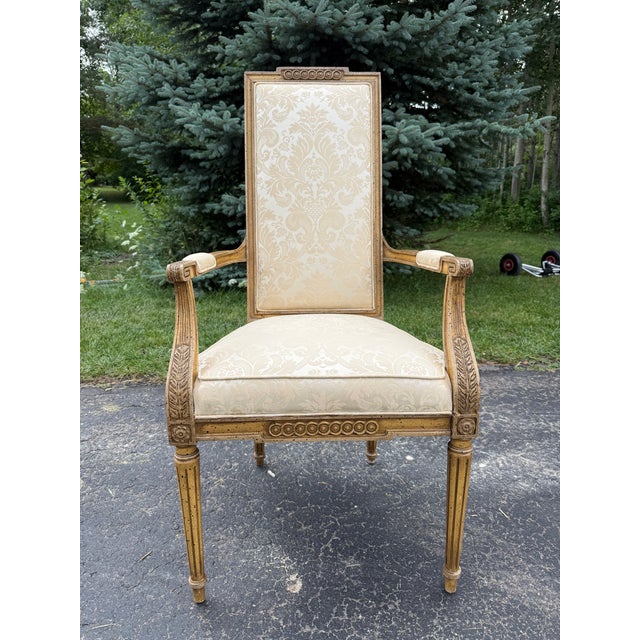 Mid-twentieth century hand-carved side chairs in the style of Louis XVI. Reupholstered in a beautiful Scalamadre damask...