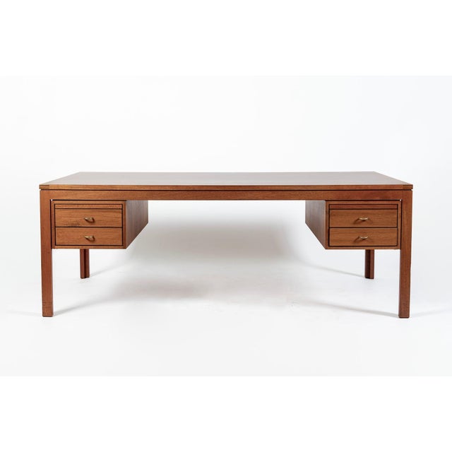 This exceptional vintage mid century Danish modern mahogany wood desk by Søborg Mobler was made in Denmark circa 1960....