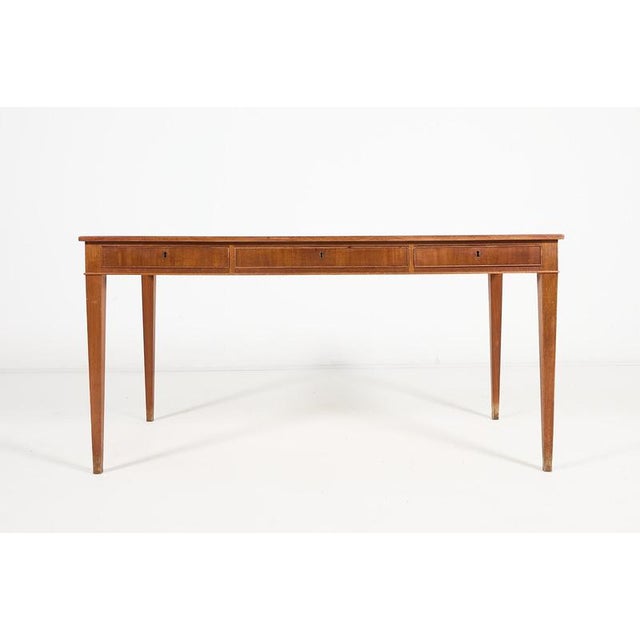 Danish Mid-Century varnished mahogany desk/table from 1950’s designed by Frits Henningsen. It features 3 drawers.Condition...