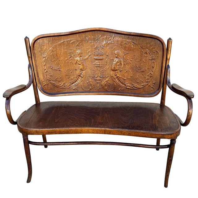 Late Victorian bentwood settee bench with angel motif by Jacob & Josef Kohn. Crafted with the companies signature steam-...