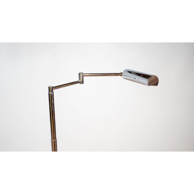 Vintage Koch & Lowy reading floor lamp circa 1970's. Chrome-plated brass floor lamp with adjustable height and swing arm...