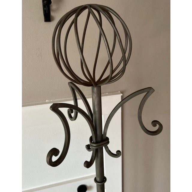 This Wrought Iron freestanding Coat & Hat Rack or Hall Tree in gray is a distinctive and stylish piece that combines...