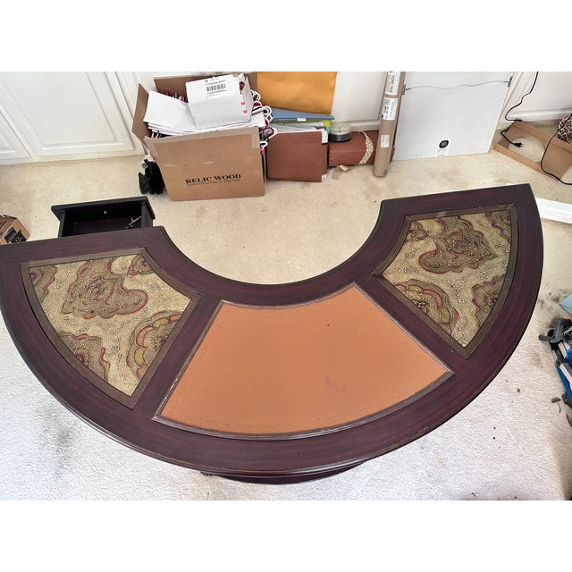 This striking Italian Mediterranean style demilune writing desk features a distinctive half-round silhouette crafted by...