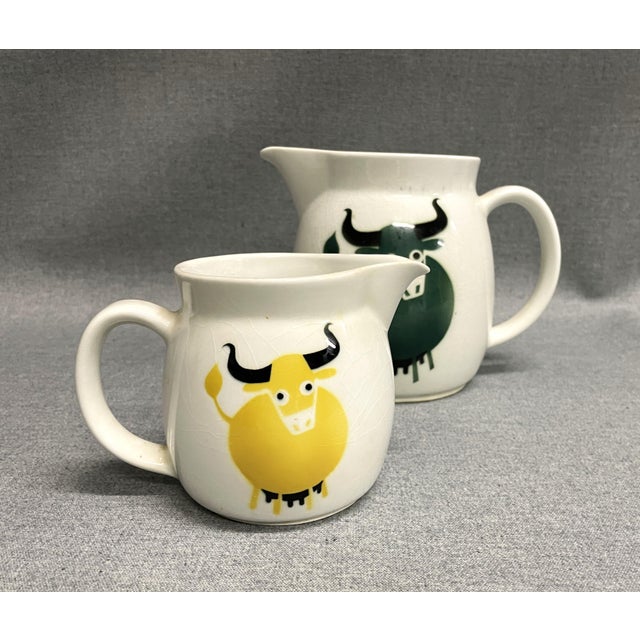 A sweet pair of Arabia bull pitchers made in Finland. There are one large and one small of the Finnish Heluna jugs with...