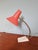 Vintage office lamp produced by the German manufacturer located in the 1960s. This articulated lamp has a red metal...