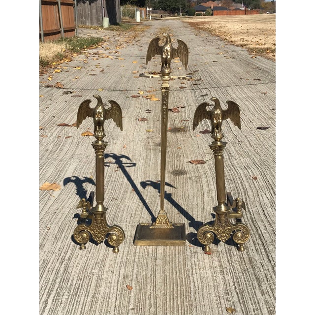 This pair of elegant andirons feature two sculptural eagles on each andiron. One large finial and a smaller eagle on the...