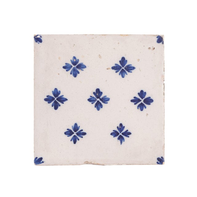 Set of 9 Delft faience tiles decorated in a cobalt blue diapered floret pattern. Delft, circa 1700's.