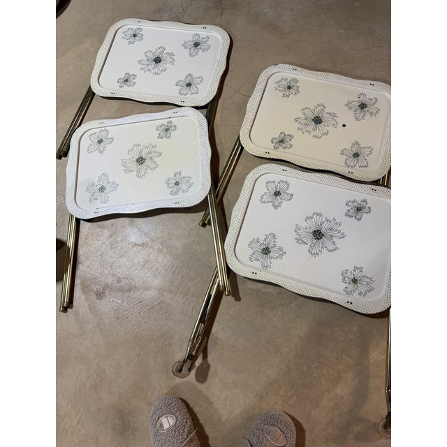 An iconic piece of 1950s/1960s Americana, this complete vintage set includes four folding TV tray tables and their...