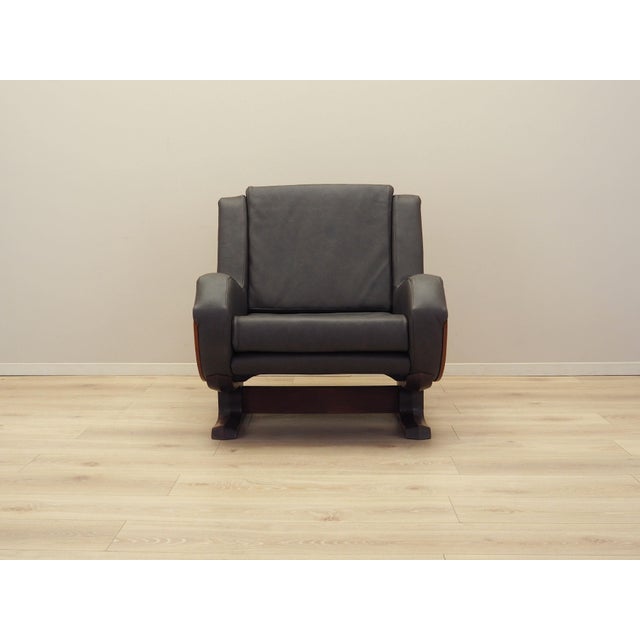 The armchair was made in the 1970s, Italian production. The structure and legs are made of solid walnut wood. Wood after...